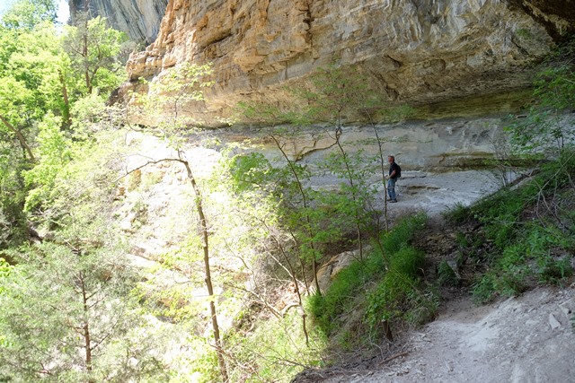 Bill exploring the cliffs beneath Hemmed-In Hollow falls
